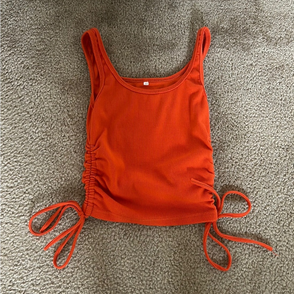 Orange TankTop. XS but stretches. Adjustable length with scrunches on the sides.